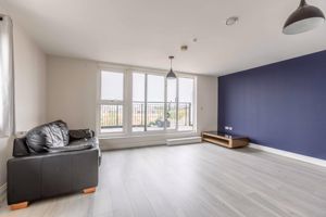 Living room + Balcony- click for photo gallery